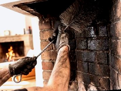Soft brush detailing a firebox before brick repair
